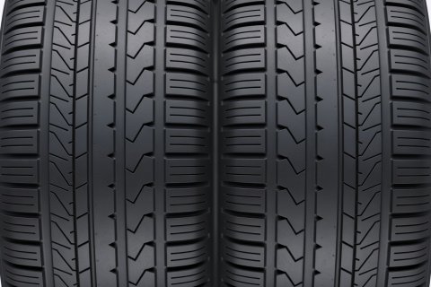 Soft-lit 3D render of a symmetric tyre tread block pattern with continuous ribs
